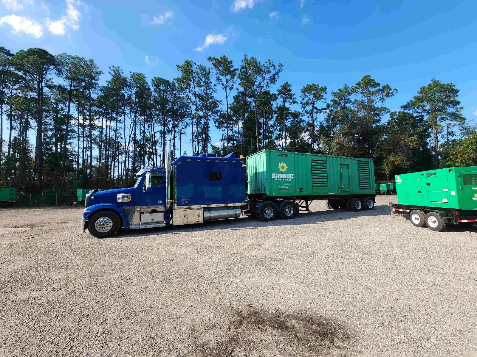 Generator transported on power-only trailer for Port of Miami delivery by M Taylor Inc
