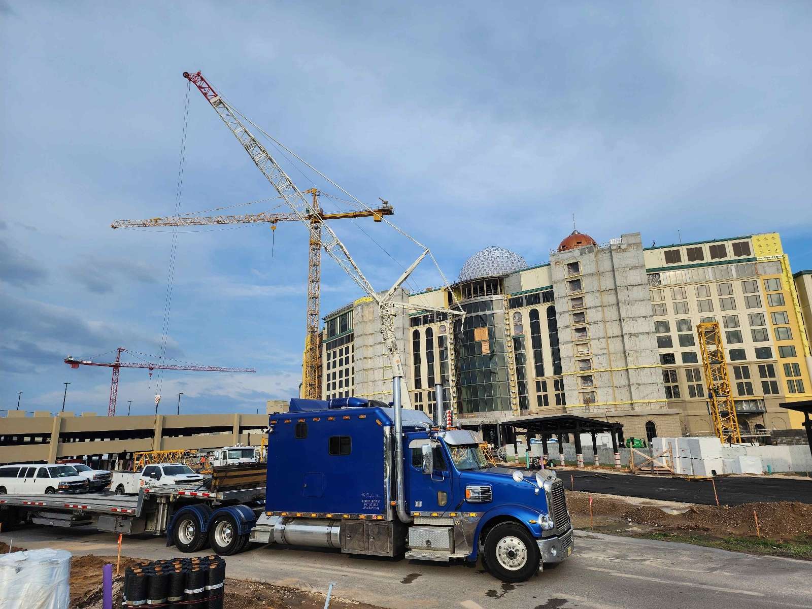 Construction equipment hauled on stepdeck trailer in Collier County Florida by M Taylor Inc