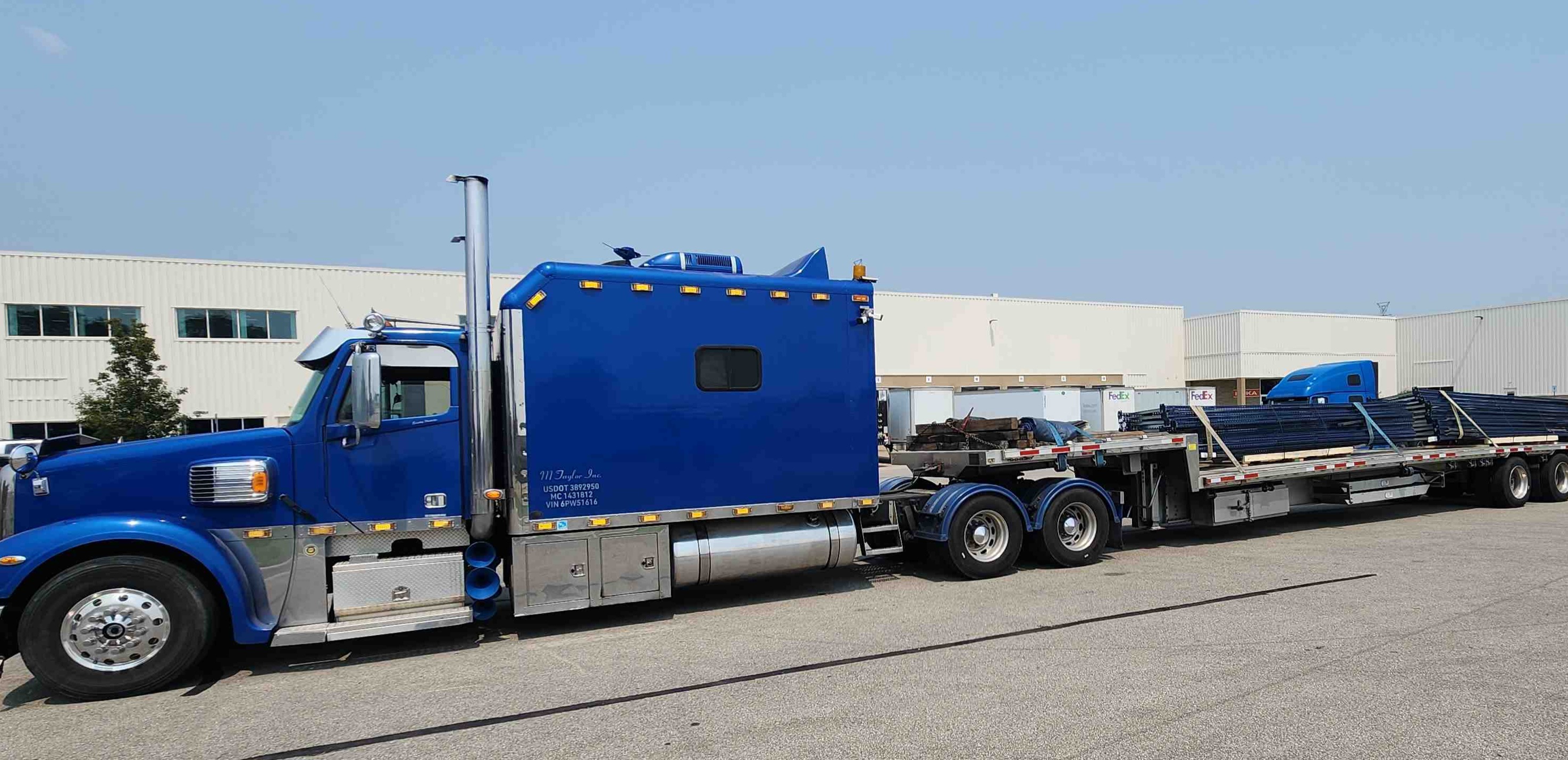 Disaster recovery equipment hauled on stepdeck trailer in Fort Myers Lee County Florida