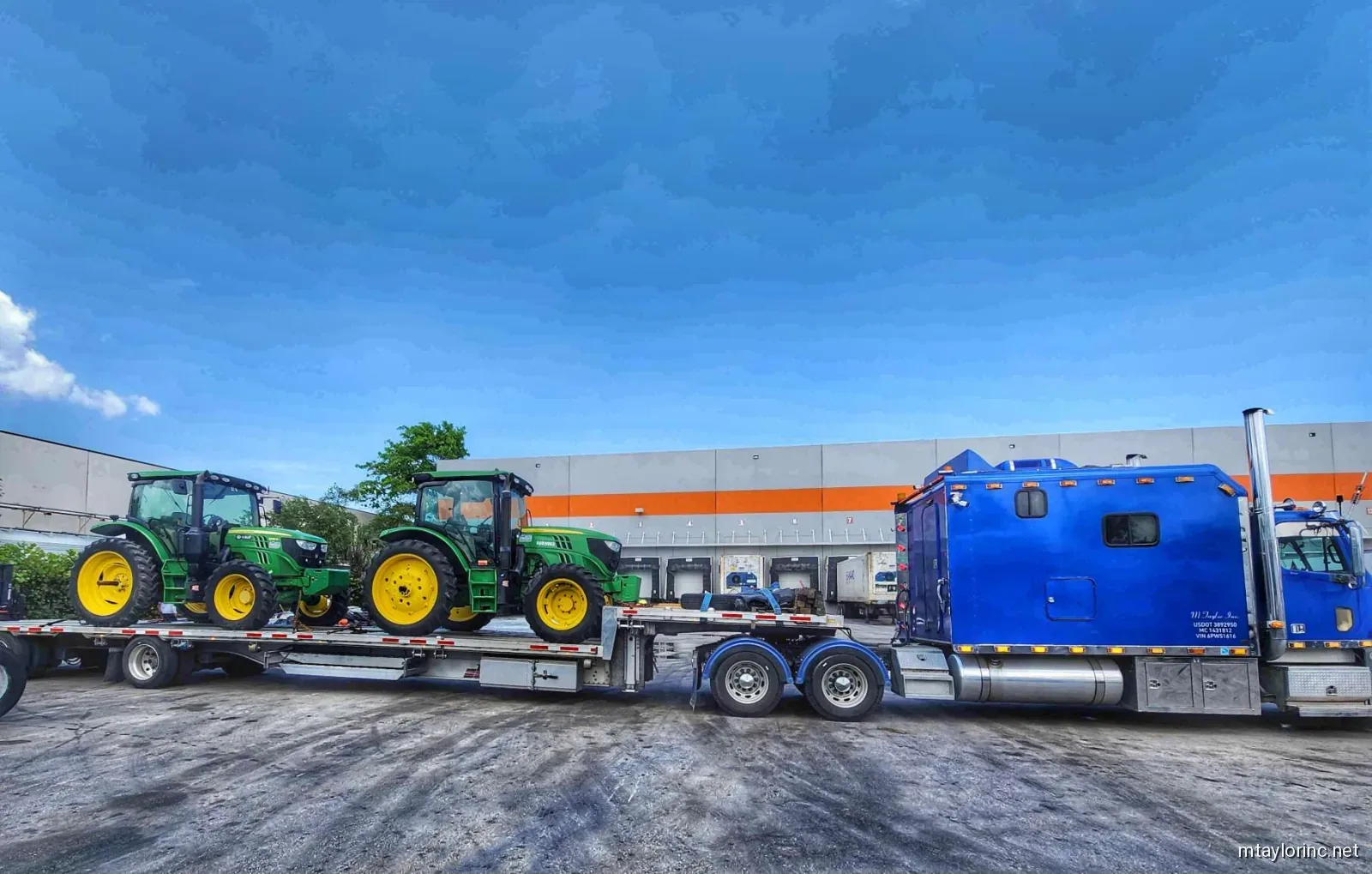 Agricultural tractor hauled on stepdeck trailer