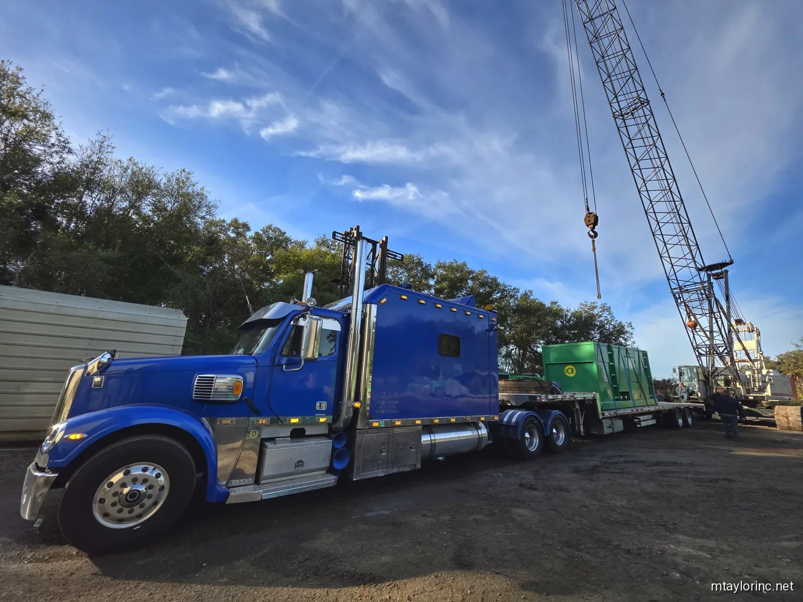 M Taylor Inc stepdeck loading John Deere generator at electrical substation