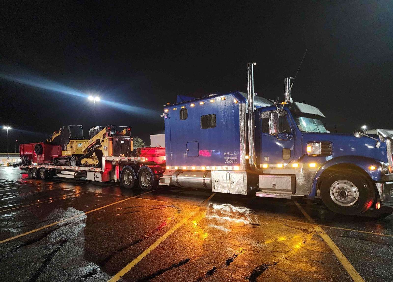 Equipment transport in Orange County Orlando Florida by M Taylor Inc stepdeck trucking